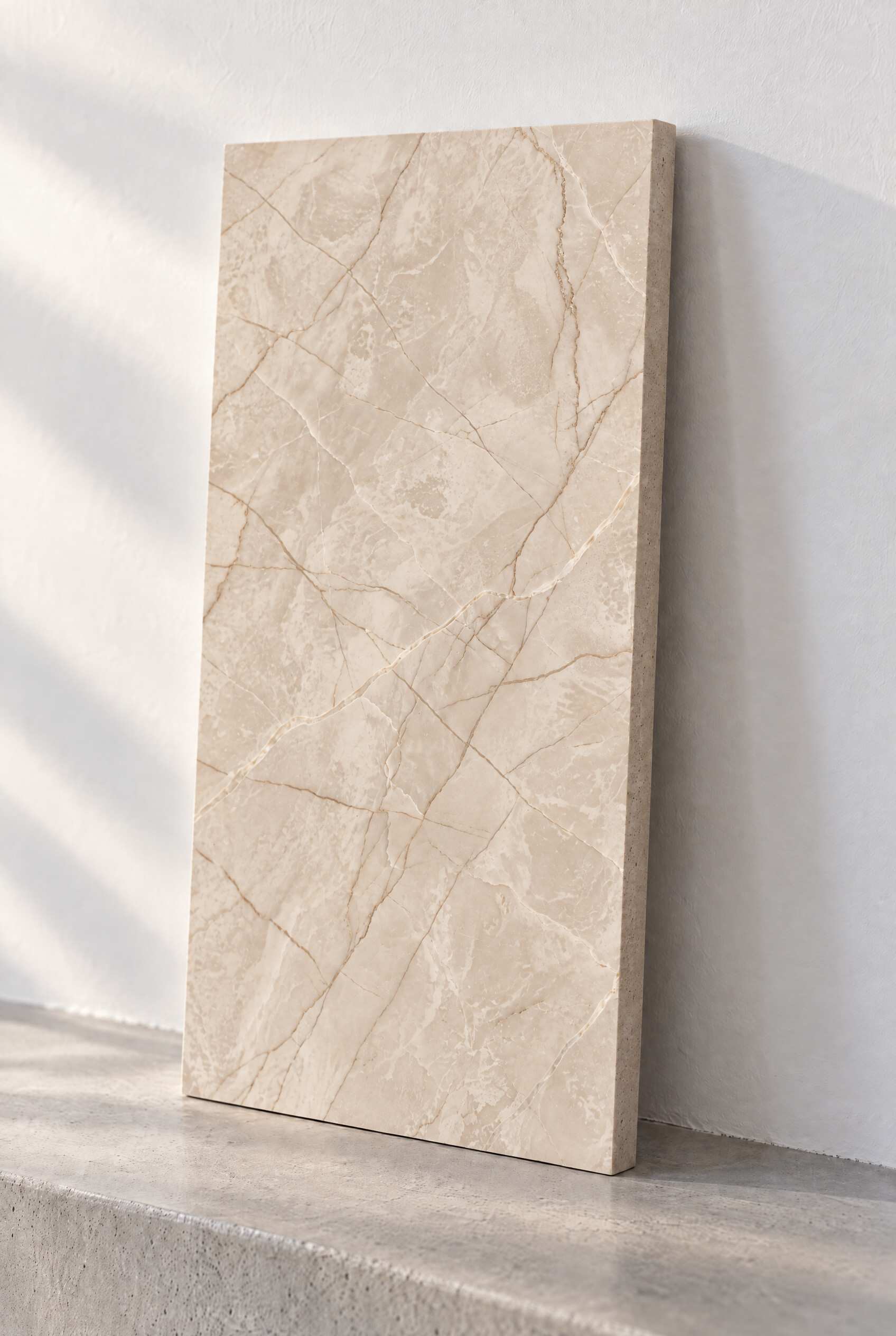 Illustration of a honed marble tile in Diana Royal, leaning against a white wall on a concrete step.