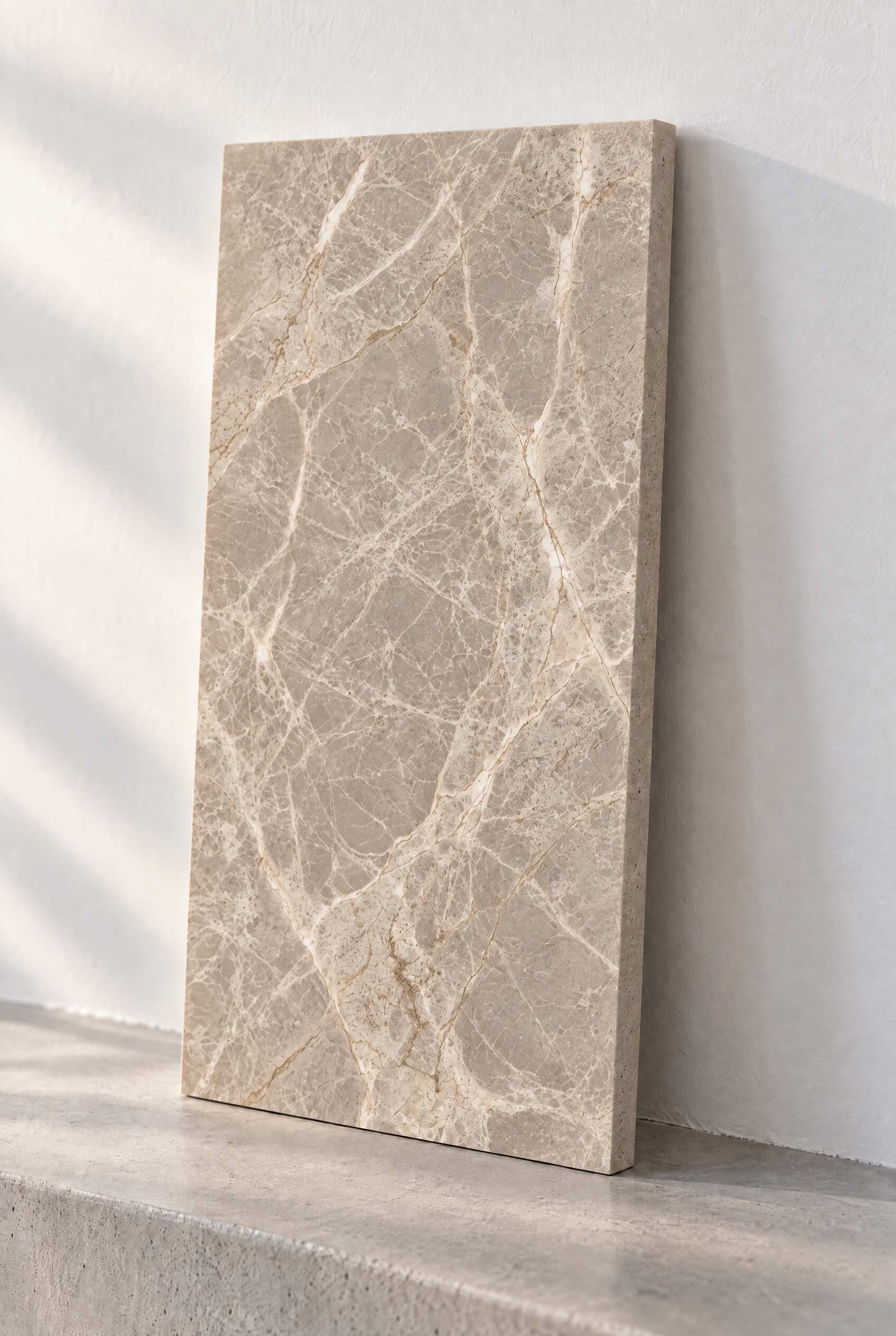Illustration of a honed marble tile in Dolomitic Beige, leaning against a white wall on a concrete step.